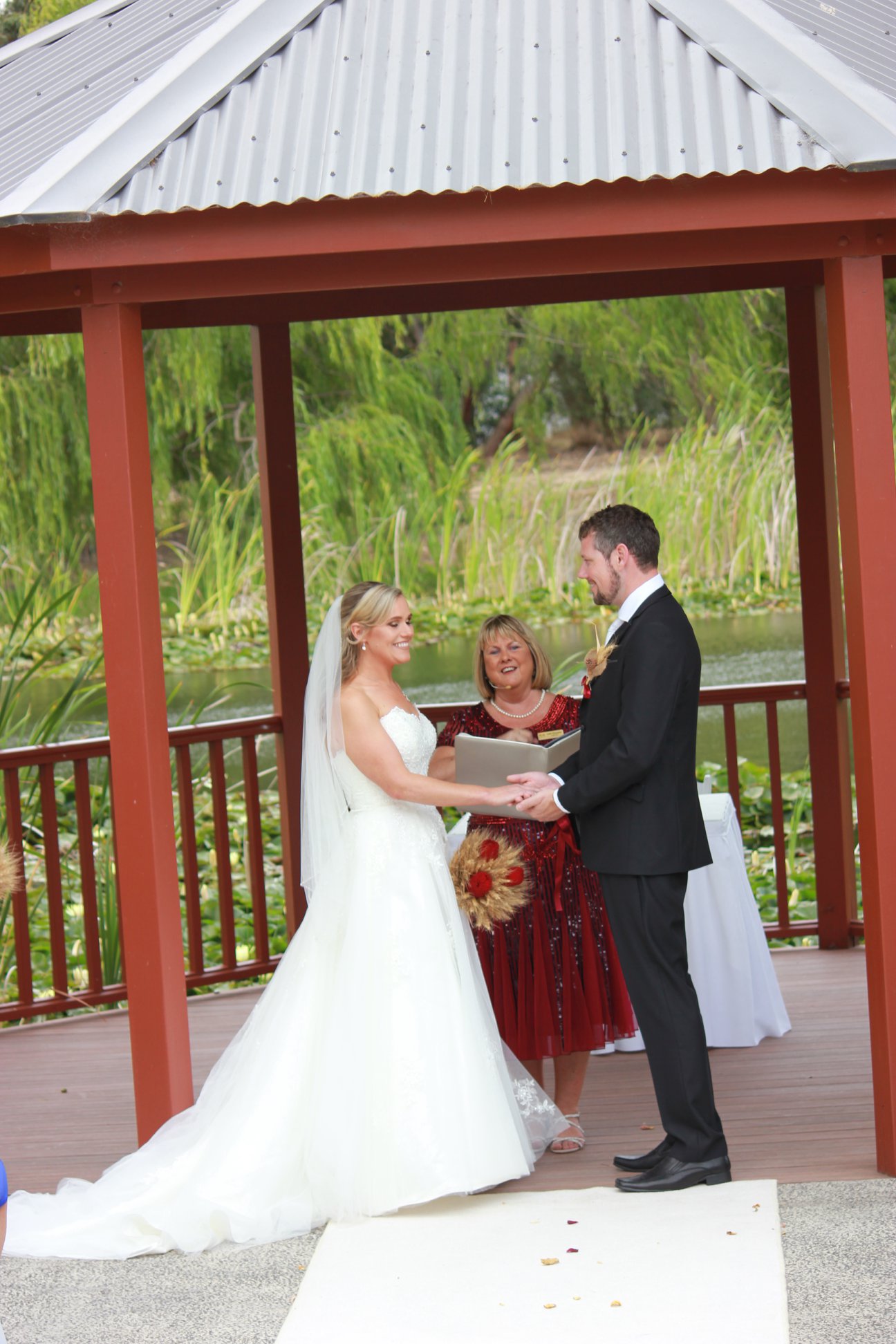 Julie marrying Emma and Brendon in the gazebo at Peel Manor